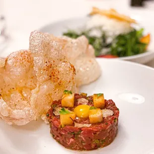 steak tartare w/ black truffle, quail egg, puff tendon