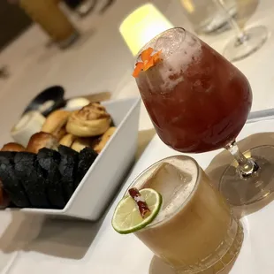 Our drinks with fresh house made breads including squid ink