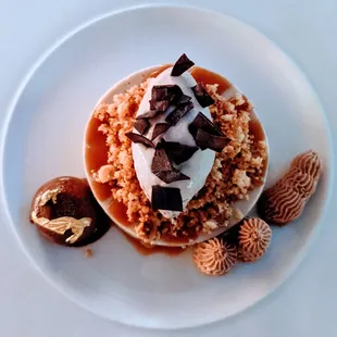 Banana bourbon panna cotta. Yuzu caramel with hazelnut crumble and banana ice cream.