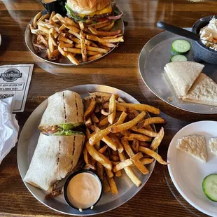 Grilled Chicken Southwest wrap (front), Ali&apos;s Burger (back) &amp; Hummus App. On the side