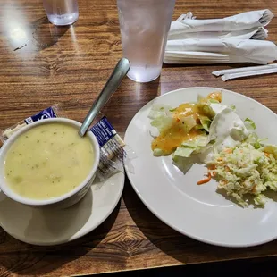 a bowl of soup and a plate of salad