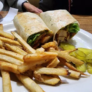 a plate of french fries and a sandwich