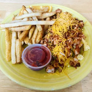 a plate of food with fries and a side of ketchup