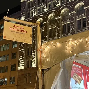 a large building with a clock tower in the background