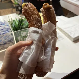 a person holding a donut