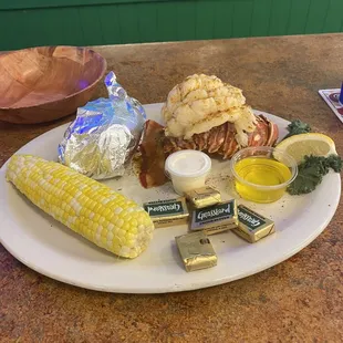 8 oz Lobster tail,  COTC, Baked Potato, $40.  Pretty good deal and very tasty.