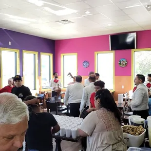 a large group of people eating