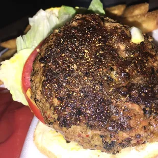 I found the Greek burger to pretty much be an American burger but with Greek seasoning. Cooked in an iron skillet.