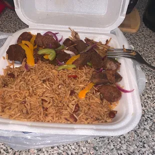 Dry and tasteless rice, basic fried turkey. Did they even use epis? ‍‍‍