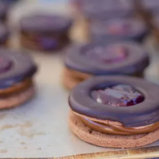 Linzer style alfajores with Dulce de Leche, Raspberry Jam and Chocolate.