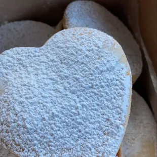 a box of heart shaped pastries