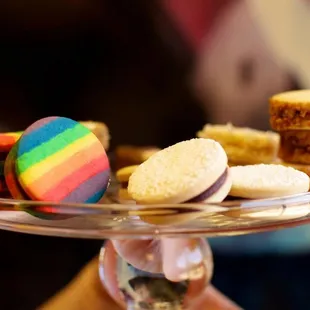 a person holding a plate of cookies