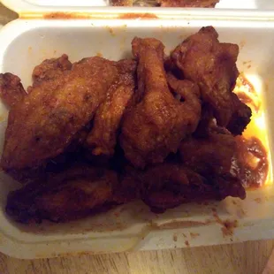 chicken wings in a styrofoam container