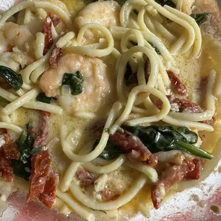 My leftover shrimp scampi special with spinach, sun dried tomatoes and a creamy butter sauce. Delicious