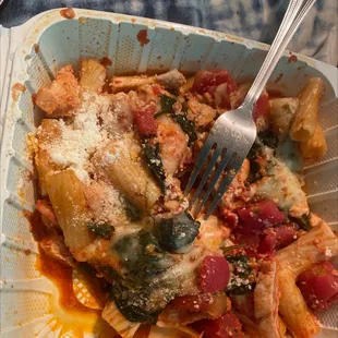 a pasta dish with a fork