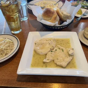 Chicken piccata with a side of pasta and garlic rolls !! yum!