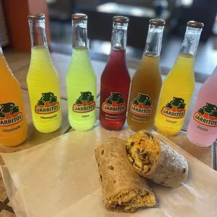 a burrito and six bottles of soda