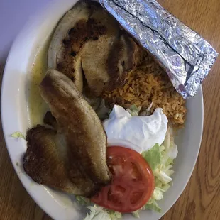 Garlic fish awesome dish. You had better be hungry 2 big fish fillets awesome dish. My wife and i share the dish.