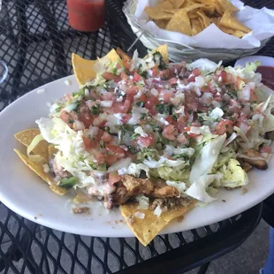 This is the nachos supreme we order it without beans and add pico. We also get grilled chicken versus shredded.