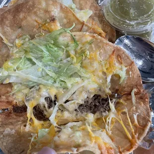 Inside a shredded beef crunchy taco. Very little meat and ingredients to charge $3.25 each.