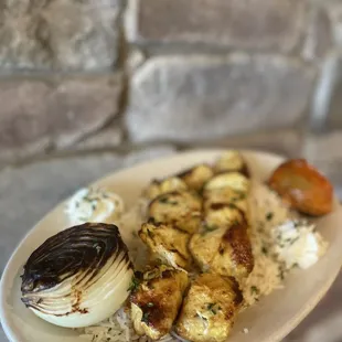 a person holding a plate of food