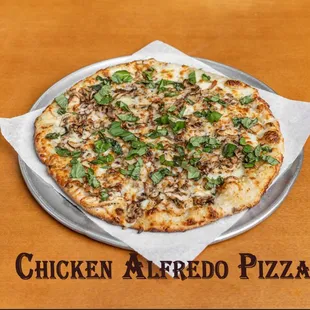 Chicken Alfredo Pizza.
Alfredo sauce, mozzarella cheese, chicken breast, mushrooms, and basil.