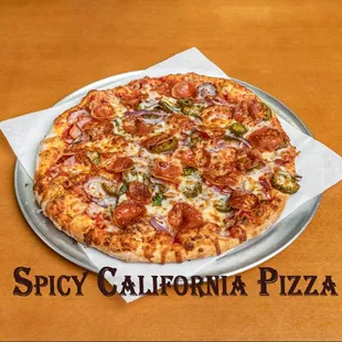 Spicy California Pizza.
Pepperoni, salami, ham, jalapenos, onions, &amp; extra cheese.