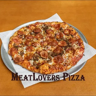 Meat Lovers Pizza.
Pepperoni, Canadian bacon, ground beef, Italian sausage and extra cheese.