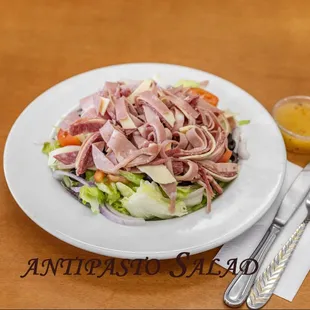 Antipasto Salad.
Lettuce, tomato, cucumber, pepperoncini, onions, black olives, salami, mortadella, provolone &amp; mozzarella.