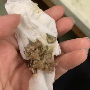 Looks like it&apos;s plastic casing attached to the meat