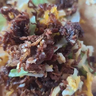This is the inside of taco after I went searching for the edible part. Didn&apos;t find it.