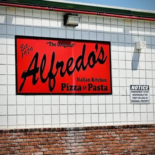 a sign on the side of a building