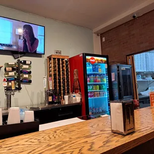 a bar with a television on the wall