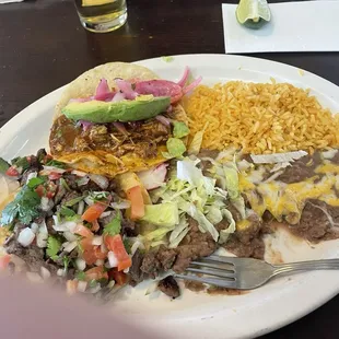 2 Taco combo... asada y cochinito. Comes w arroz con frijoles