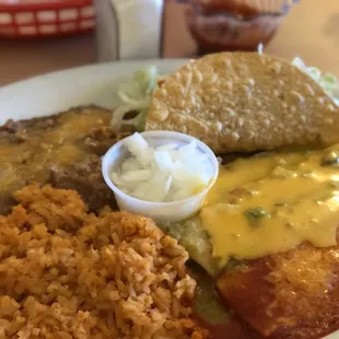 Two cheese enchiladas one with red sauce and one with queso. Heck yeah! A taco and rice and beans. Delish.