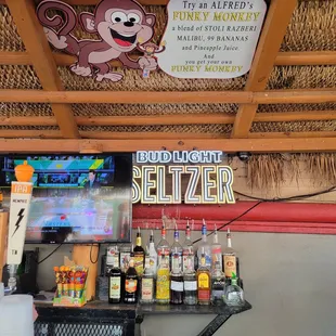 a bar with a monkey sign above it