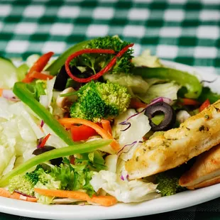 a salad with chicken and vegetables