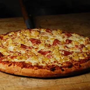 a pizza on a cutting board