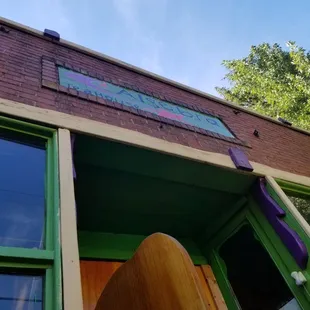a surfboard leaning against the wall