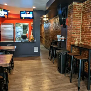 a brick wall and tables