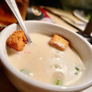 a bowl of soup with croutons