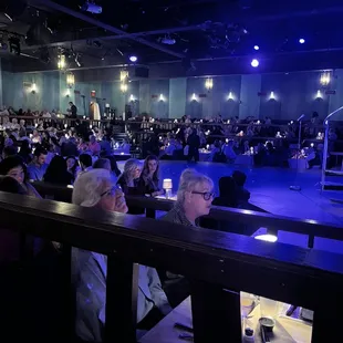 audience seated at tables