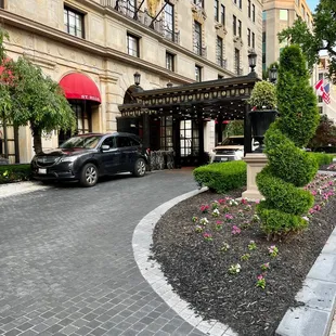 a car parked in front of a hotel