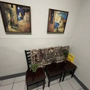 two chairs and a bench in a waiting room