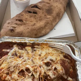 Eggplant Parmigiana with Spaghetti and Cheese Calzone with sausage