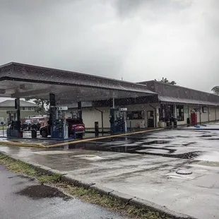a gas station in the rain