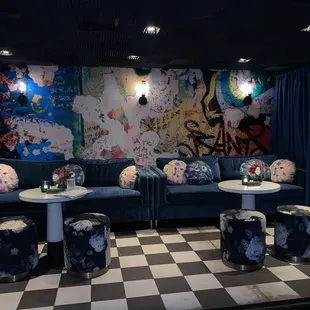 a living room with a checkered floor