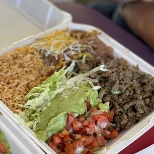 a close up of a meal in a styrofoam container