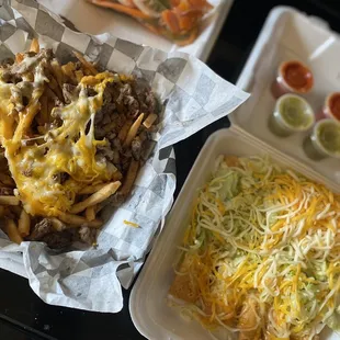 Carne asada fries and rolled tacos! They gave us some hot carrots and red and green sauce