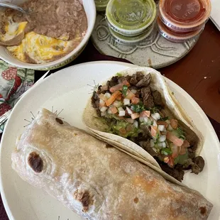 Their carne asada tacos are delicious. The burritos are gigantic. And the side of beans is big!
